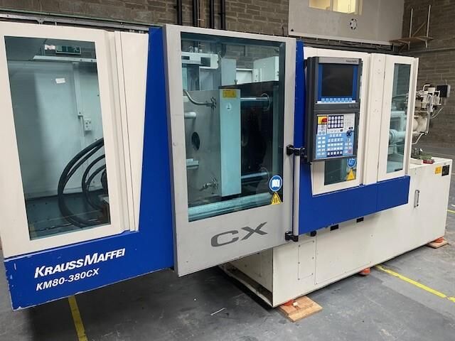 Used KRAUSS MAFFEI CX 80-380 injection moulding machine